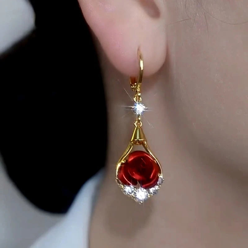 Model showcasing the dangle and style of the 14K Gold-Plated Elegant Luxury Zircon Diamond Red Rose Earrings