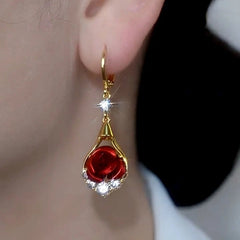 Close-up detail of the sparkling zircons and plating on the Red Rose Earrings