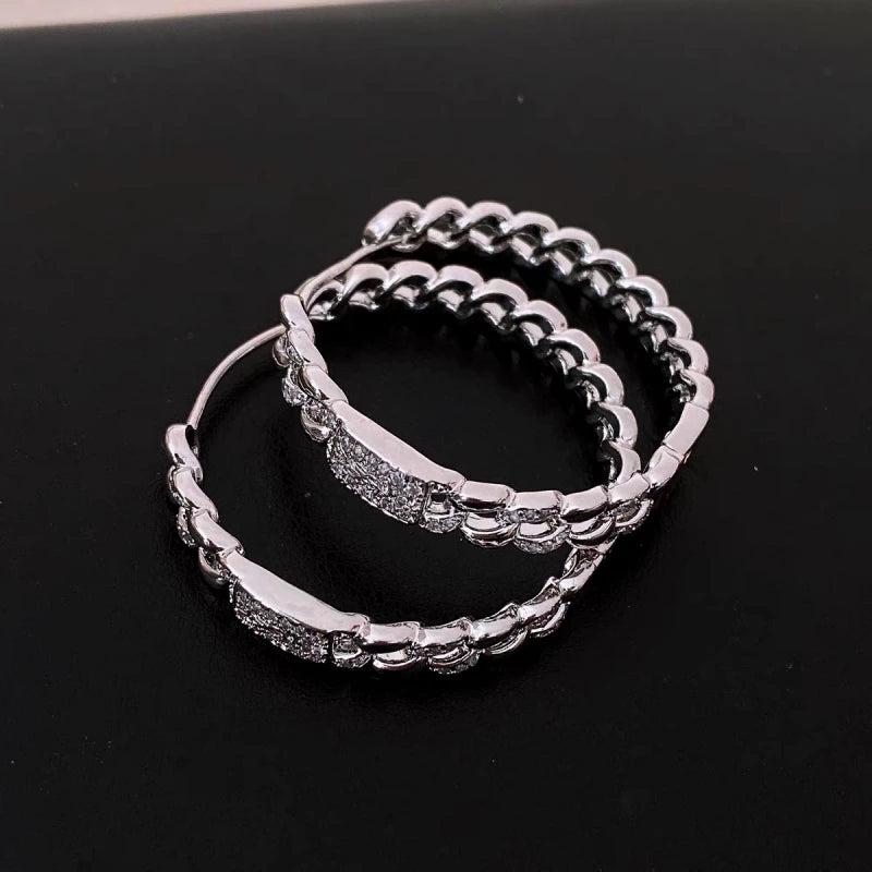 Angled view of the 14K Gold-Plated Elegant Luxury Zircon Hoop Earrings