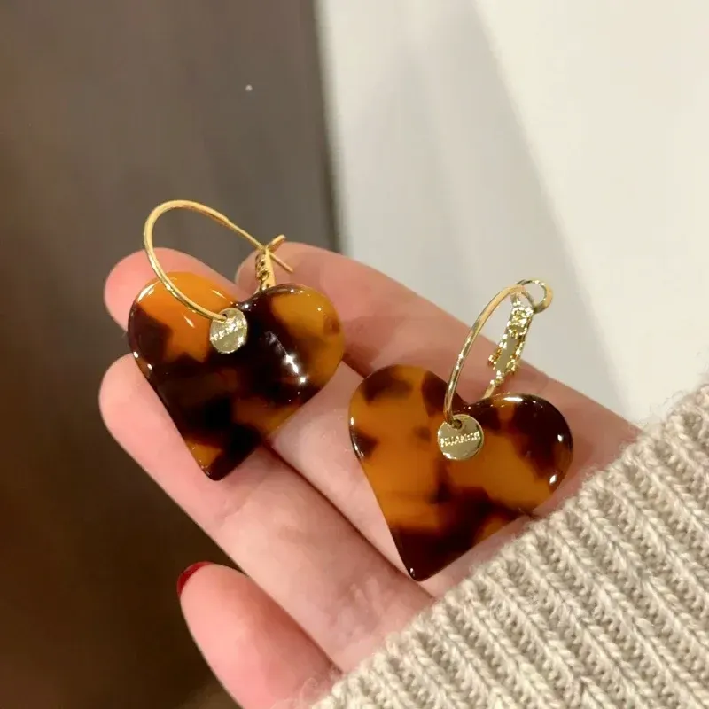 Close-up detail of the sparkling zircons and plating on the Heart Pendant Earrings