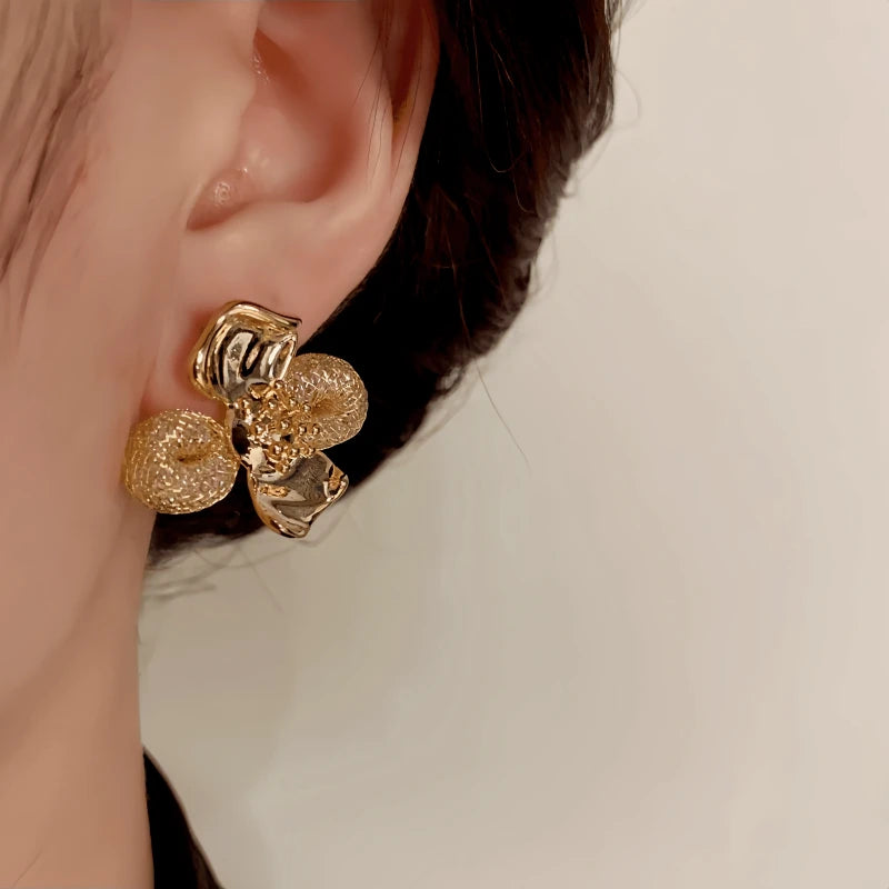 Close-up detail of the sparkling zircons and plating on the Mesh Flower Studs