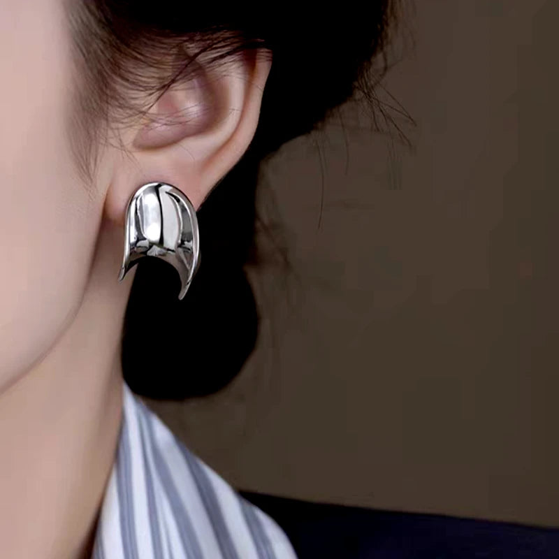 Close-up detail of the sparkling zircons and plating on the Metal Spiral Earrings