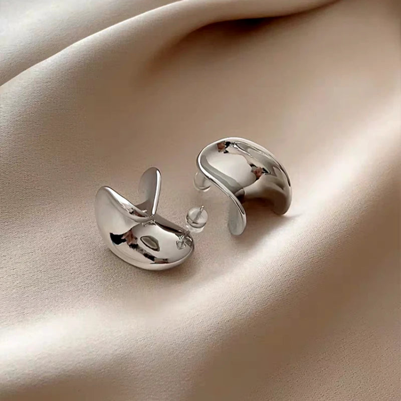 Angled view of the 14K Gold-Plated Elegant Minimalist Metal Spiral Earrings