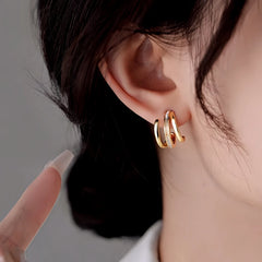 Close-up detail of the sparkling zircons and plating on the Multi-Layer Stud Earrings