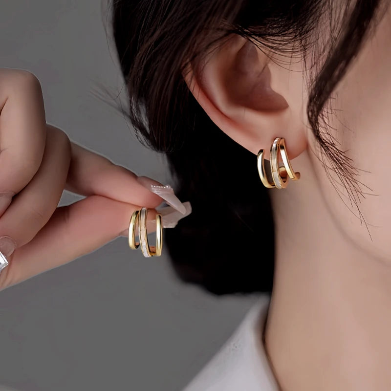 Angled view of the 14K Gold-Plated Elegant Multi-Layer Stud Earrings