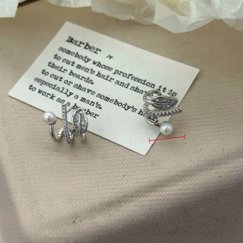 Model showcasing the dangle and style of the 14K Gold-Plated Elegant Multi-Layer Zircon Diamond Bead Leaf Studs