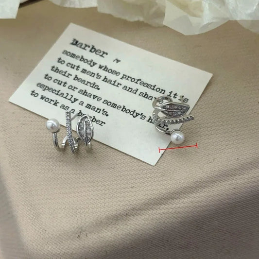 Model showcasing the dangle and style of the 14K Gold-Plated Elegant Multi-Layer Zircon Diamond Bead Leaf Studs