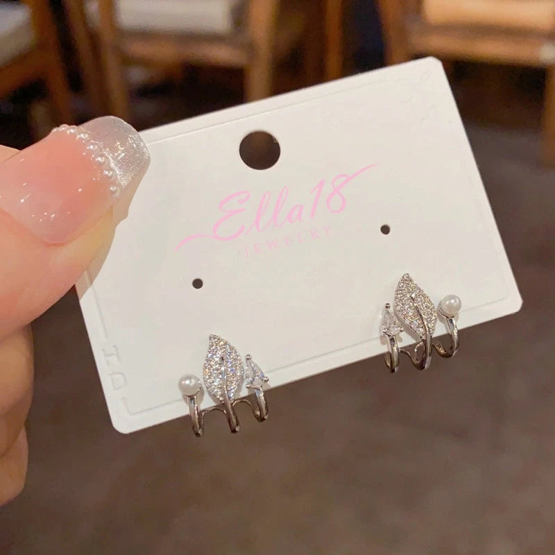 Angled view of the 14K Gold-Plated Elegant Multi-Layer Zircon Leaf Pearl Stud Earrings