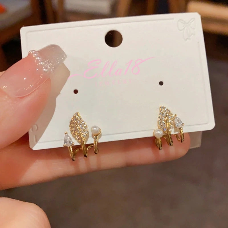 Close-up detail of the sparkling zircons and plating on the Zircon Leaf Pearl Studs