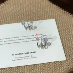 Angled view of the 14K Gold-Plated Elegant Multi-Layer Zircon Star Pearl Stud Earrings