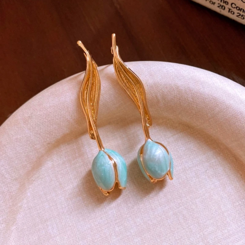 Angled view of the 14K Gold-Plated Elegant Oil-Drop Leaf Tulip Earrings