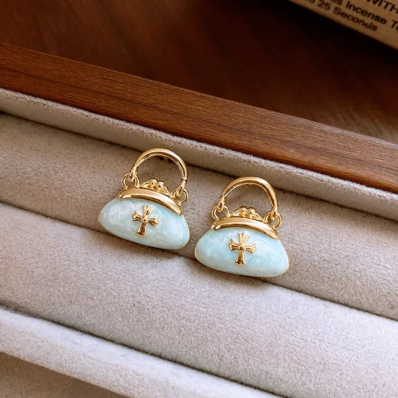 Close-up detail of the sparkling zircons and plating on the Pink Bag Earrings