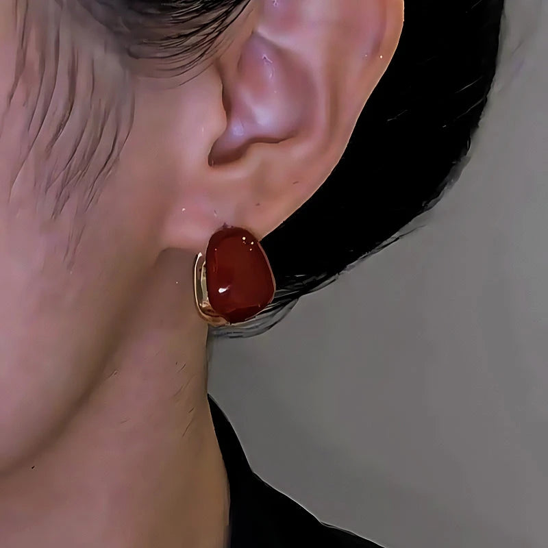 Close-up detail of the sparkling zircons and plating on the Red Oil Drop Earrings