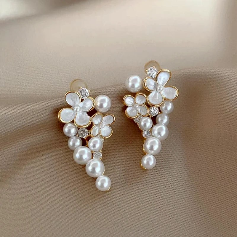 Angled view of the 14K Gold-Plated Elegant Oil Drop Flower Pearl Tassel Earrings