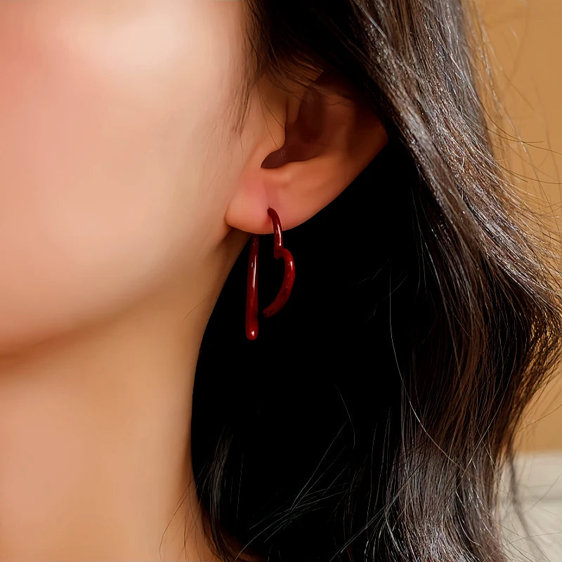 Close-up detail of the sparkling zircons and plating on the Heart Earrings