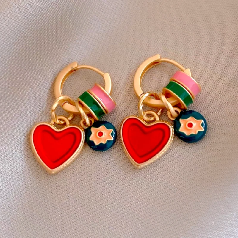 Close-up detail of the sparkling zircons and plating on the Heart Pendant Earrings