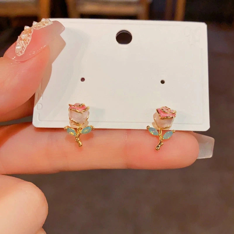 Angled view of the 14K Gold-Plated Elegant Oil Drop Rose Stud Earrings