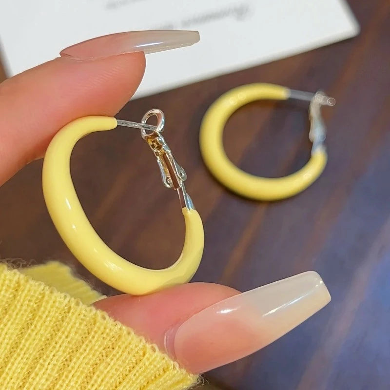 Angled view of the 14K Gold-Plated Elegant Oil Drop Yellow Hoop Earrings