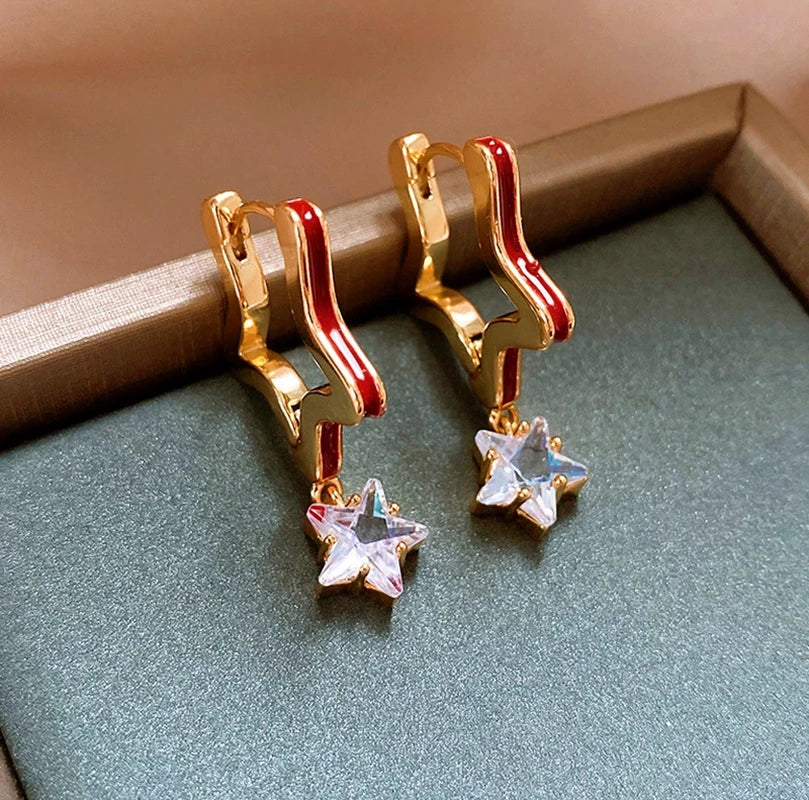 Angled view of the 14K Gold-Plated Elegant Oil Drop Zircon Star Earrings