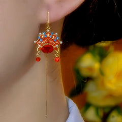 Close-up detail of the sparkling zircons and plating on the Opera Mask Threader Earrings