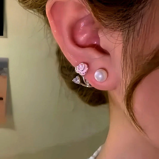 Model showcasing the dangle and style of the 14K Gold-Plated Elegant PInk Oil Drop Rose Pearl Jacket Earrings