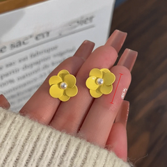 Angled view of the 14K Gold-Plated Elegant Pale Yellow Flower Stud Earrings