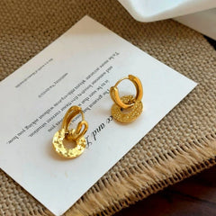 Close-up detail of the sparkling zircons and plating on the Peace Locket Earrings