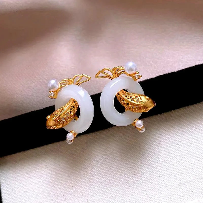 Model showcasing the dangle and style of the 14K Gold-Plated Elegant Peace Studs