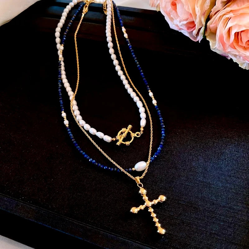 The perfect Pearl Cross Necklace for layering or wearing as a statement piece