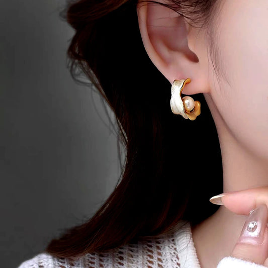 Model showcasing the dangle and style of the 14K Gold-Plated Elegant Pearl C-Shaped Earrings