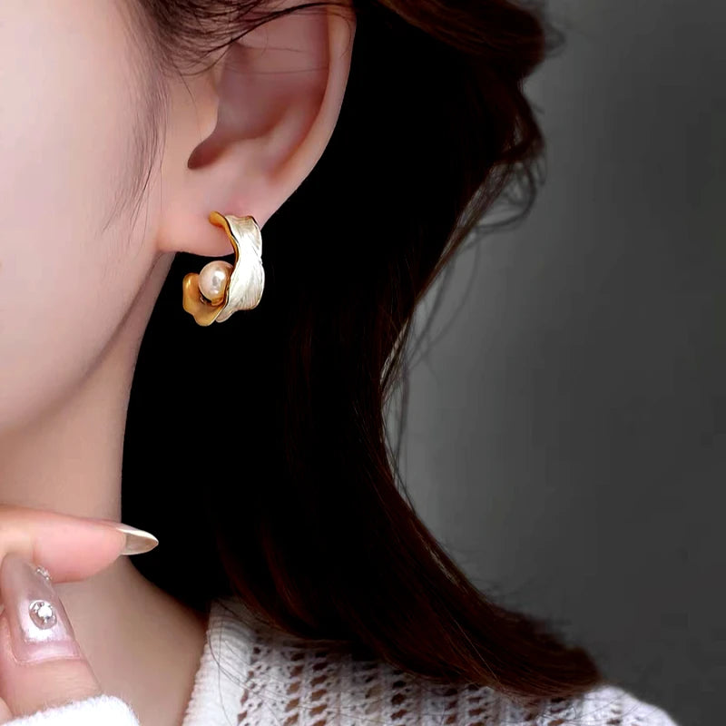 Close-up detail of the sparkling zircons and plating on the Pearl C-Shaped Earrings