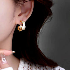 Close-up detail of the sparkling zircons and plating on the Pearl C-Shaped Earrings