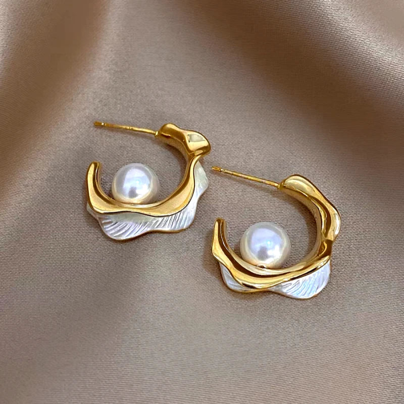 Angled view of the 14K Gold-Plated Elegant Pearl C-Shaped Earrings