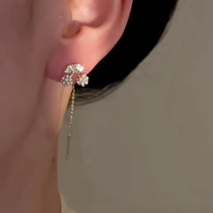 Close-up detail of the sparkling zircons and plating on the Cherry Threader Earrings