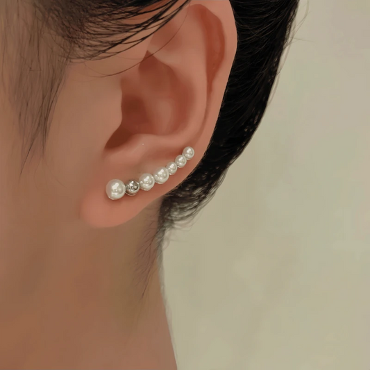 Model showcasing the dangle and style of the 14K Gold-Plated Elegant Pearl Crawler Earrings