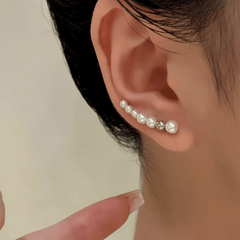 Close-up detail of the sparkling zircons and plating on the Pearl Crawler Earrings