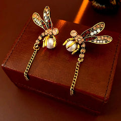 Close-up detail of the sparkling zircons and plating on the Dragonfly Tassel Earrings