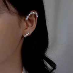 Model showcasing the dangle and style of the 14K Gold-Plated Elegant Pearl Ear Cuff