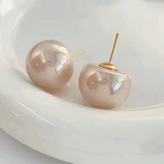 Close-up detail of the sparkling zircons and plating on the Pearl Earrings