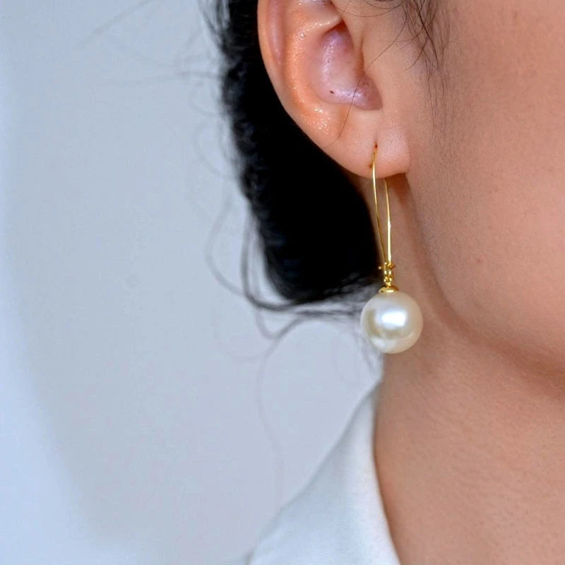 Close-up detail of the sparkling zircons and plating on the Pearl Earrings