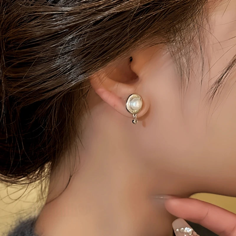 Close-up detail of the sparkling zircons and plating on the Pearl Earrings