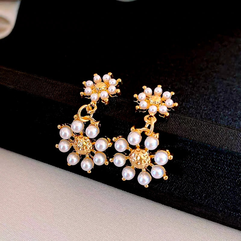 Close-up detail of the sparkling zircons and plating on the Pearl Flower Tassel Earrings