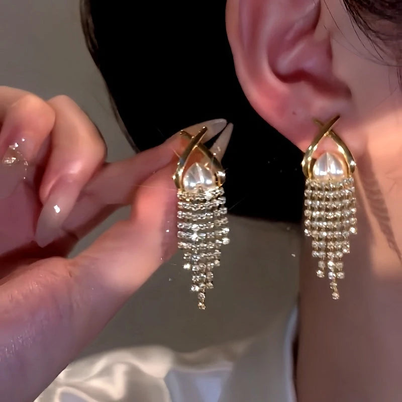 Close-up detail of the sparkling zircons and plating on the Pearl Heart Tassel Earrings