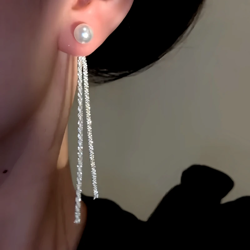 Close-up detail of the sparkling zircons and plating on the Pearl Tassel Earrings