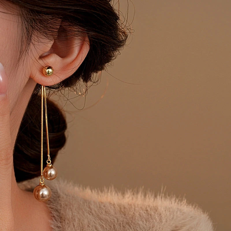 Close-up detail of the sparkling zircons and plating on the Pearl Tassel Earrings