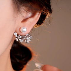 Model showcasing the dangle and style of the 14K Gold-Plated Elegant Pearl Zircon Flower Jacket Earrings