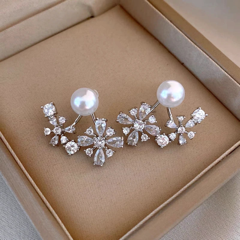 Close-up detail of the sparkling zircons and plating on the Zircon Flower Jacket Earrings