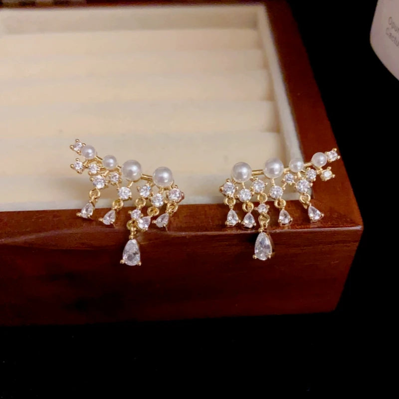 Close-up detail of the sparkling zircons and plating on the Pearl Zircon Tassel Earrings