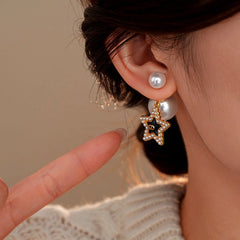 Close-up detail of the sparkling zircons and plating on the Star Pearl Earrings