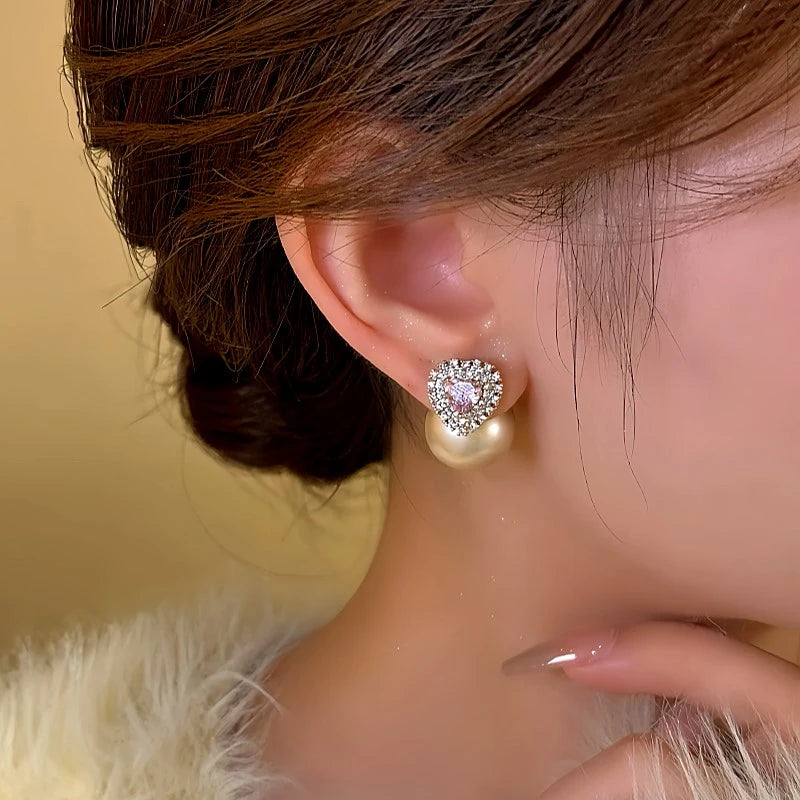 Close-up detail of the sparkling zircons and plating on the Pink Heart Pearl Earrings